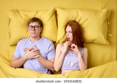 Embarrassed And Shy Man Lying On Bed With Experienced Excited Female Before His First Intimacy In Bed, Inexperience