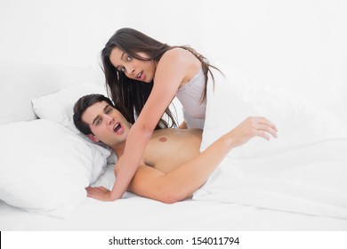 Embarrassed Young Couple Caught In The Act In Bed 