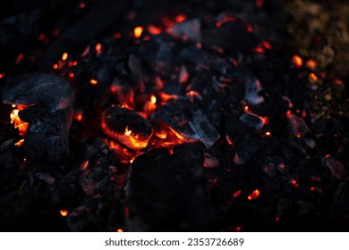 Embers burn in hearth. Hot coals for frying meat. Burnt wood texture. Hot Item. - Powered by Shutterstock