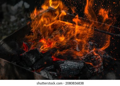embers burning with a bright orange flame
