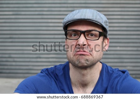 Embittered man judging something close up