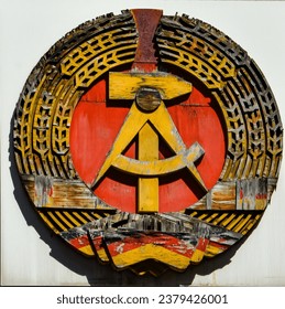 the emblem of the German democratic republic - had socialist symbols. The hammer symbolizes workers, the compasses - scientists and the intelligentsia, and the ears of corn - peasants.