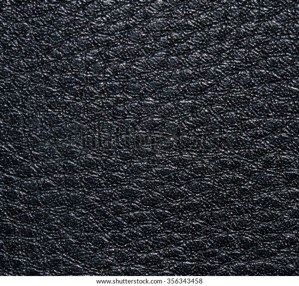 Embossed black leather texture, with\
irregular shapes and veins. Leather texture.\
Closeup
