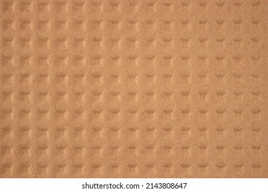 Embossed Brown Kraft Paper As Background With Copy Space. Sustainable Packaging Concept