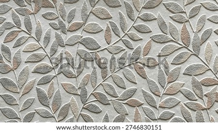 Embossed leaf pattern on a textured surface with soft pastel tones of beige, gray, and light brown, creating an elegant and decorative botanical design.