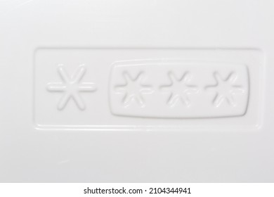 Embossed Sign In The Form Of Snowflakes In Rectangle On The Plastic Inner Wall Of Freezer Denoting Freezing And Storage Mode Of Food Or Refrigerator Class, Close-up 
