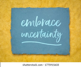 embrace uncertainty motivational note - handwriting on a handmade rag paper, unknown future, change, risk and chance concept