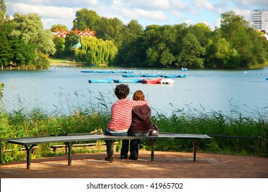 Embraced Lovers On A Bench At Regent's Park, London. UK