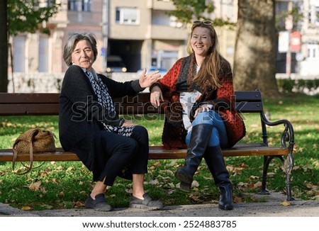 Similar – Image, Stock Photo Twin sisters look around in an alleyway