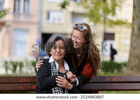 Similar – Image, Stock Photo two sisters laugh heartily on the street