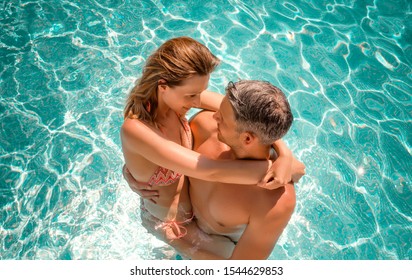 embracing love couple within summer spa hotel - Powered by Shutterstock