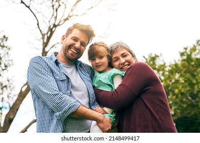 Embracing The Love Of Family. Shot Of A Multigenerational Family Outside.