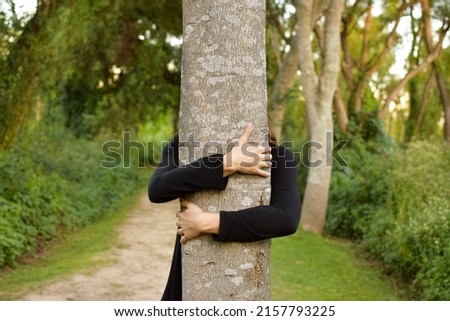 Similar – hands of woman hugging a tree