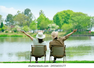 Embracing Serenity: Seniors Enjoying Lakeside Leisure - Powered by Shutterstock