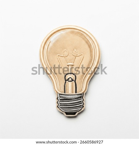 Embroidered Light Bulb Patch on a white background