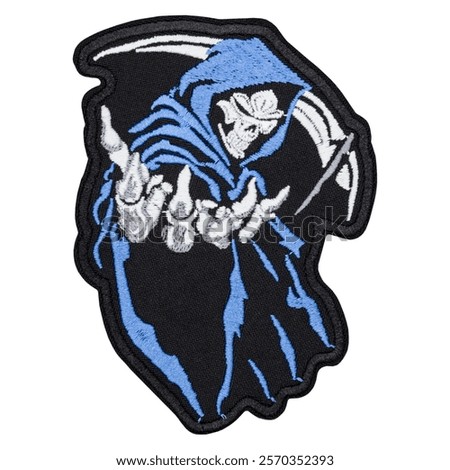 Embroidered patch featuring the grim reaper with a scythe, dressed in a blue robe. Perfect for adding a dark, mysterious touch to jackets, bags, and other accessories. High-quality embroidery