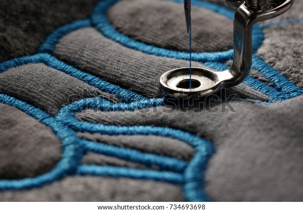 embroidery and application with embroidery machine\
- macro of progress satin stitch - background and foreground\
blanked out blurry