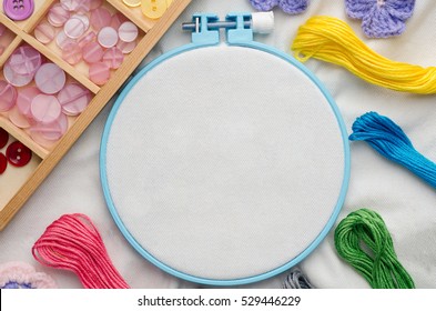 Embroidery Hoop With Blank Fabric, Colored Sewing Threads And Various Sewing Buttons