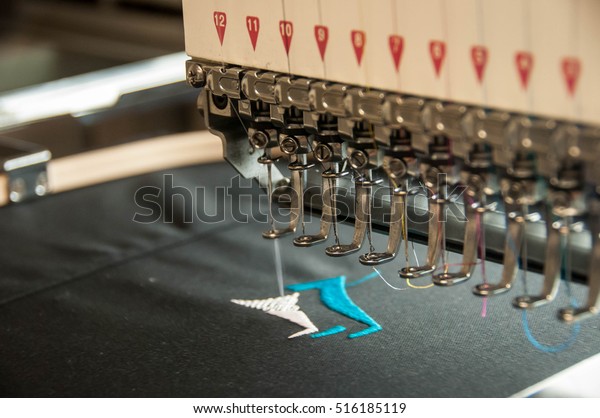 embroidery machine stitching a\
logo 