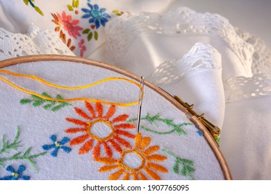 Embroidery Or Needlepoint - The Craft Of Decorating Fabric Or Other Materials Using A Needle To Apply Thread Or Yarn. Embroidery May Also Incorporate Other Materials Such As Pearls, Beads And Sequins.