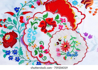 Embroidery. Patchwork handwork embroidery closeup texture pattern studio photo background.