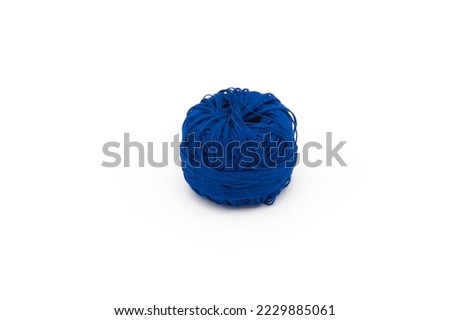 Embroidery thread roll in darkblue color on white background