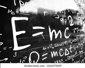Emc2 formula on black wall. Science background image.