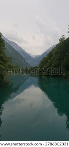 Emerald alpine lake reflection at Sigmund Thun Gorge in Kaprun, Austria
