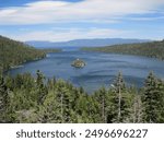 Emerald Bay at Lake Tahoe gleams with turquoise waters surrounded by lush forests and rugged peaks. Fannette Island, with its historic Tea House, sits serenely in the bay