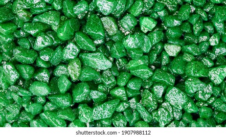 Emerald gemstone fake pattern. Green glitter stones for garden decoration, flat lay, top view background.
