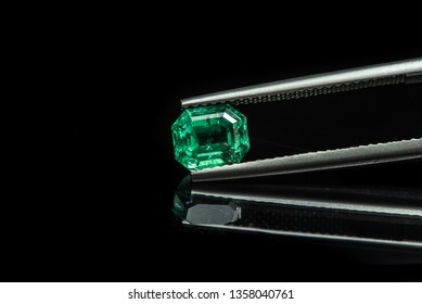 Emerald Gemstone In Tweezers