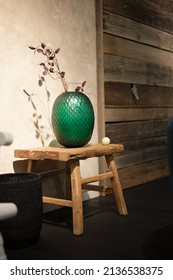 Emerald Glass Vase In Rural Interior Decorated With Weathered Wood