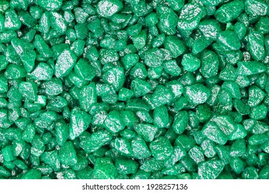 Emerald green gemstone pattern. Glitter semiprecious stones for decoration, flat lay, top view background.