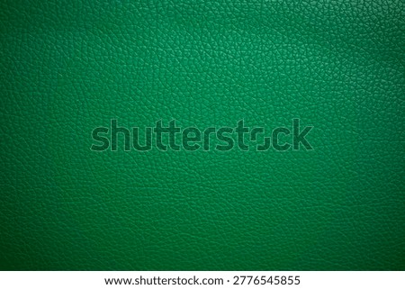 Emerald green leather texture background vignette.Use for jacket sofa book cover tag shoes.Soft green leather jacket close up, macro leather jacket texture, soft rugged grain pattern surface fashion design bg