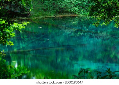 An emerald green pond filled with spring water only,yuza town,Yamagata Prefecture,japan - Shutterstock ID 2000193647