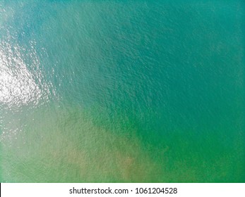 Emerald Green Sea And Orange Sand.
Look From The Top Corner Down.