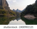 The emerald green water of the Nine Bend River or Jiuxi river through Wuyishan or mount wuyi scenic area in Fujian Province China. Sunset background