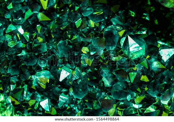 Emerald, Sapphire or Tourmaline\
green crystals. Gems. Mineral crystals in the natural environment.\
Stone of precious crystals on white background is\
insulated