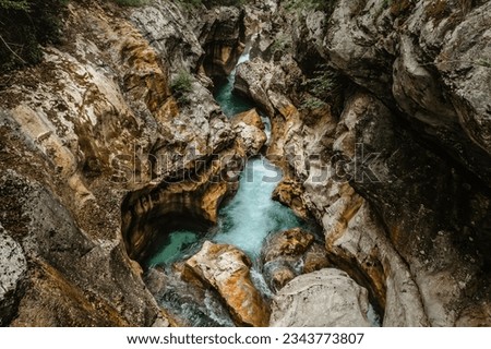 Emerald Soca River in Soca Valley, Slovenia. Aerial Drone Top view.Summer outdoor activities.Crystal clear water.Rafting and kayaking place in Europe.Wilderness adventure concept.Pure nature