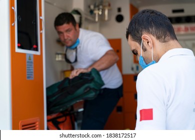 Emergency Aid Team Preparing For Emergency Response To The Patient In The Ambulance