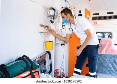 Emergency Aid Team Preparing For Emergency Response To The Patient In The Ambulance