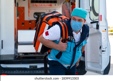 Emergency Aid Team Preparing For Emergency Response To The Patient In The Ambulance