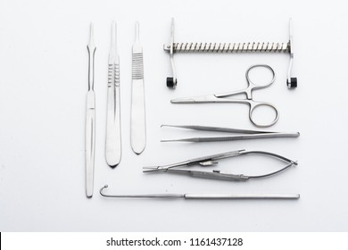 Emergency, ambulance and healthcare concept. Medical surgical instrument and laboratory equipment, bandage and medical tests isolated on white background closeup view with selective focus
