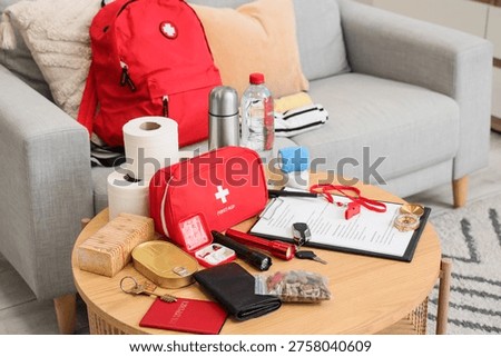 Emergency backpack with necessities on table in living room