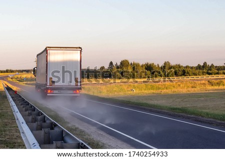 Emergency braking of a loaded truck on dry asphalt. Safety concept and stopping distance with ABS, copy space