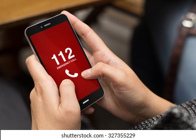 emergency concept: girl using a digital generated phone with emergency call on the screen. All screen graphics are made up. - Powered by Shutterstock