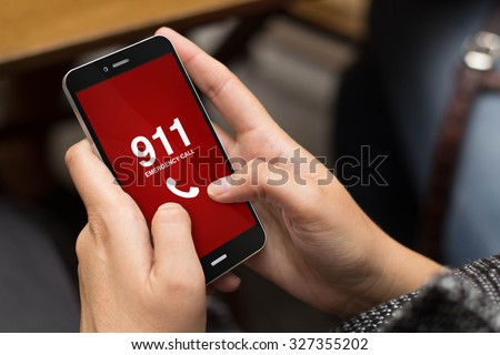emergency concept: girl using a digital generated phone with emergency call on the screen. All screen graphics are made up.