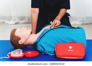 Emergency CPR Training on dummy , nurse using stethoscope to checking breat on unconscious person, One part of the process resuscitation. - Powered by Shutterstock