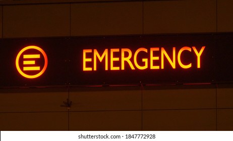 Emergency Department Service Red Sign On Hospital Building At Night