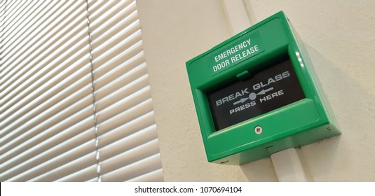 emergency door switch green install on the wall with  on fire for ringing the bell alarm